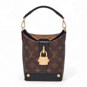 Louis Vuitton Reverse Monogram Bento Box bag.